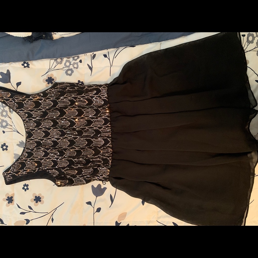 Women’s black and gold dress
